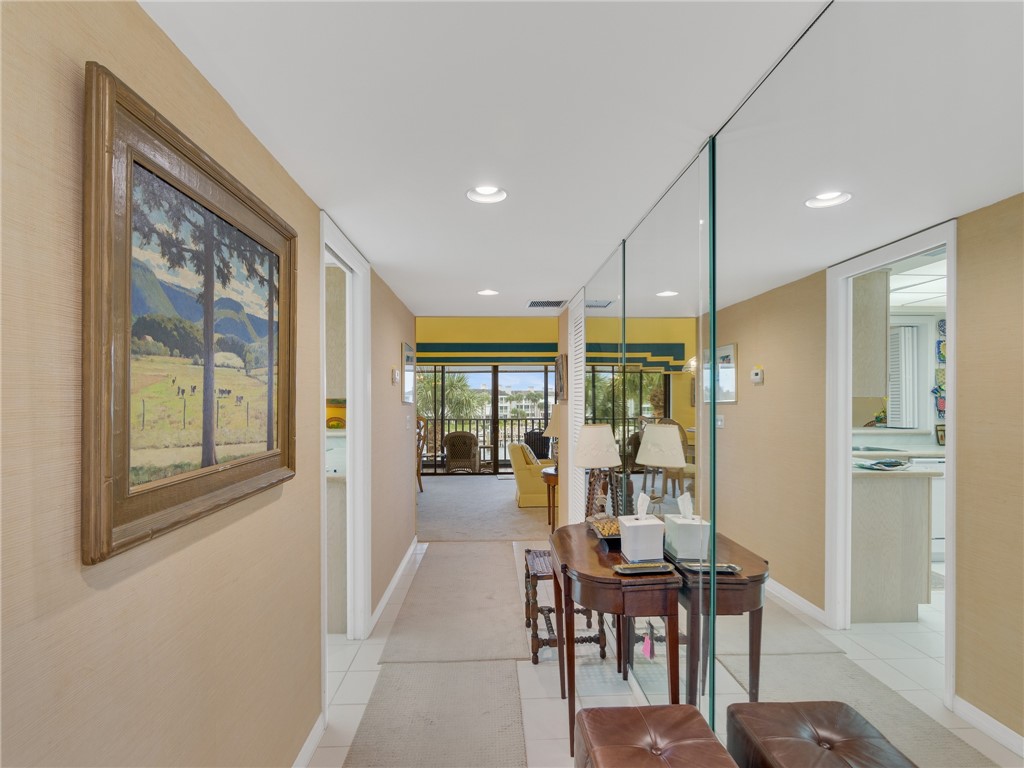 1880 Bay Road, Unit I319 Vero Beach, FL 32963 - Photo 10 of 36 a view of a dining room with furniture window and wooden floor
