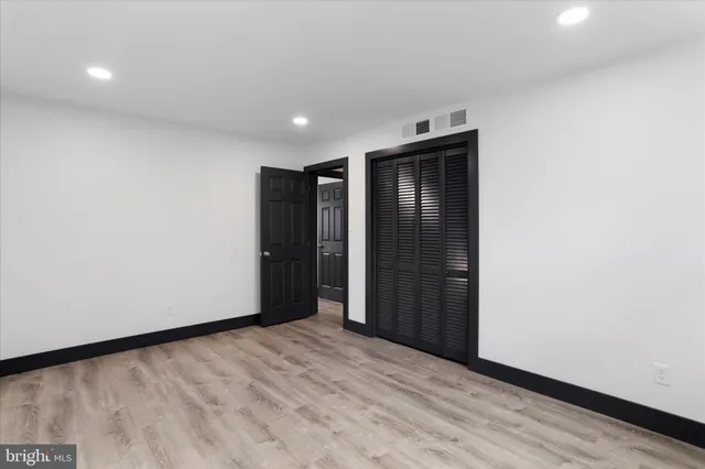 a view of hallway with wooden floor