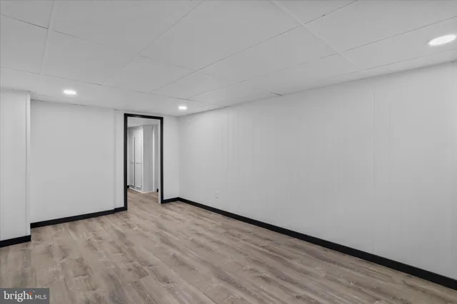 a view of an empty room and wooden floor