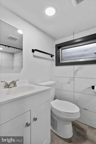 a bathroom with a toilet and a sink