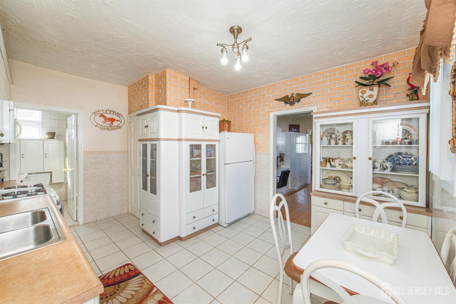 4 Lefferts Street Carteret, NJ 07008 - Photo 13 of 32 a living room with furniture and a chandelier