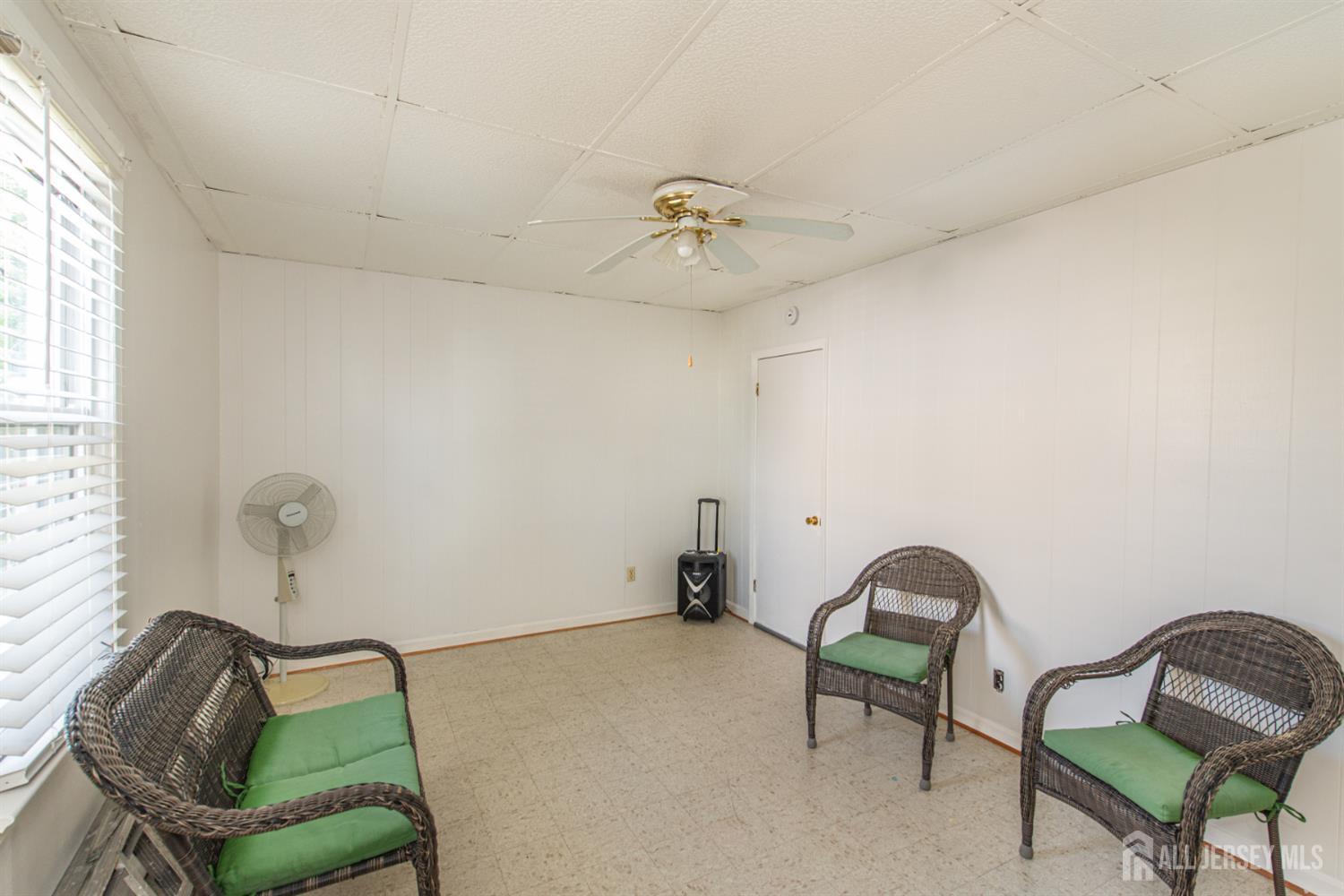4 Lefferts Street Carteret, NJ 07008 - Photo 16 of 32 a living room with furniture and a window