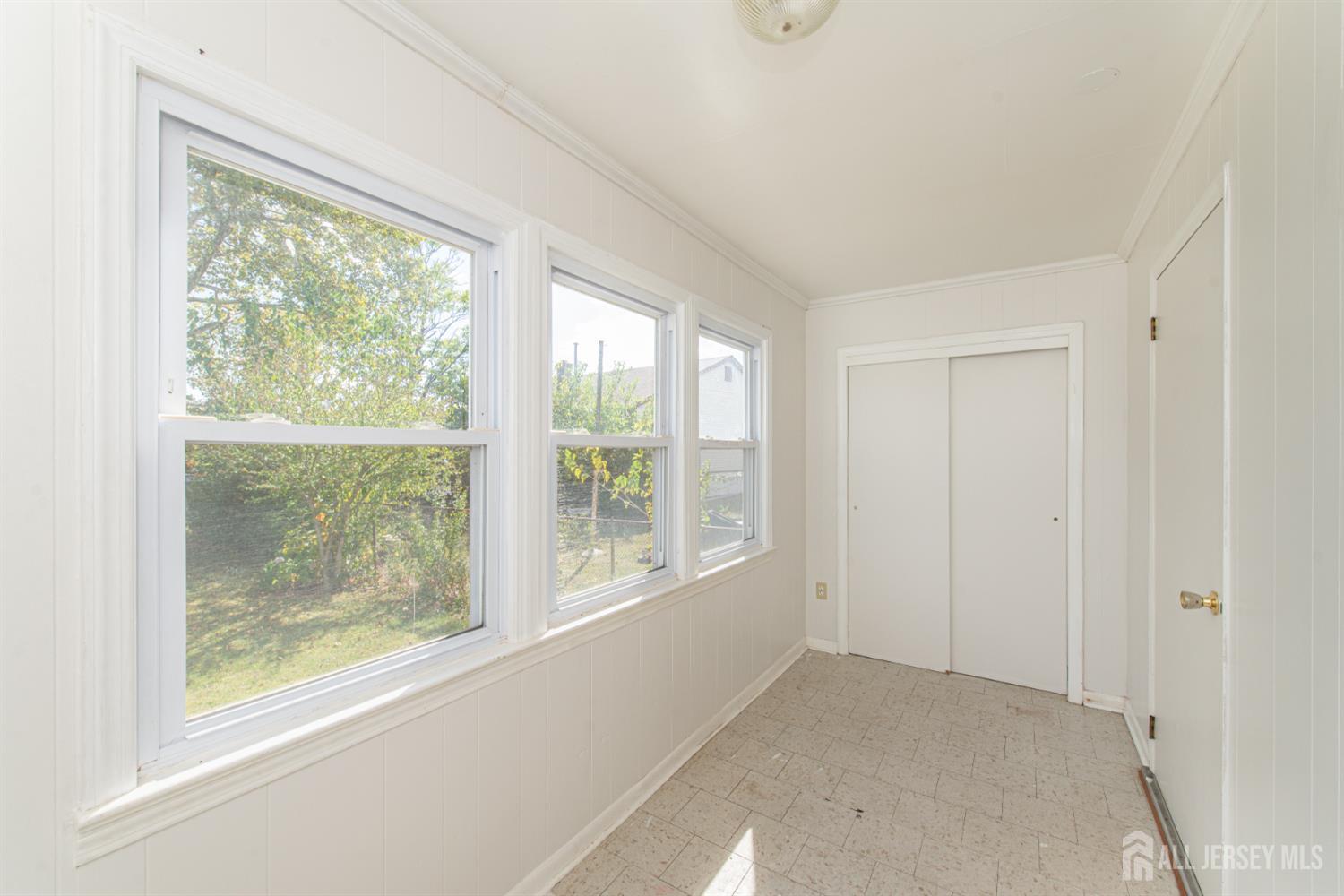 4 Lefferts Street Carteret, NJ 07008 - Photo 19 of 32 an empty room with windows