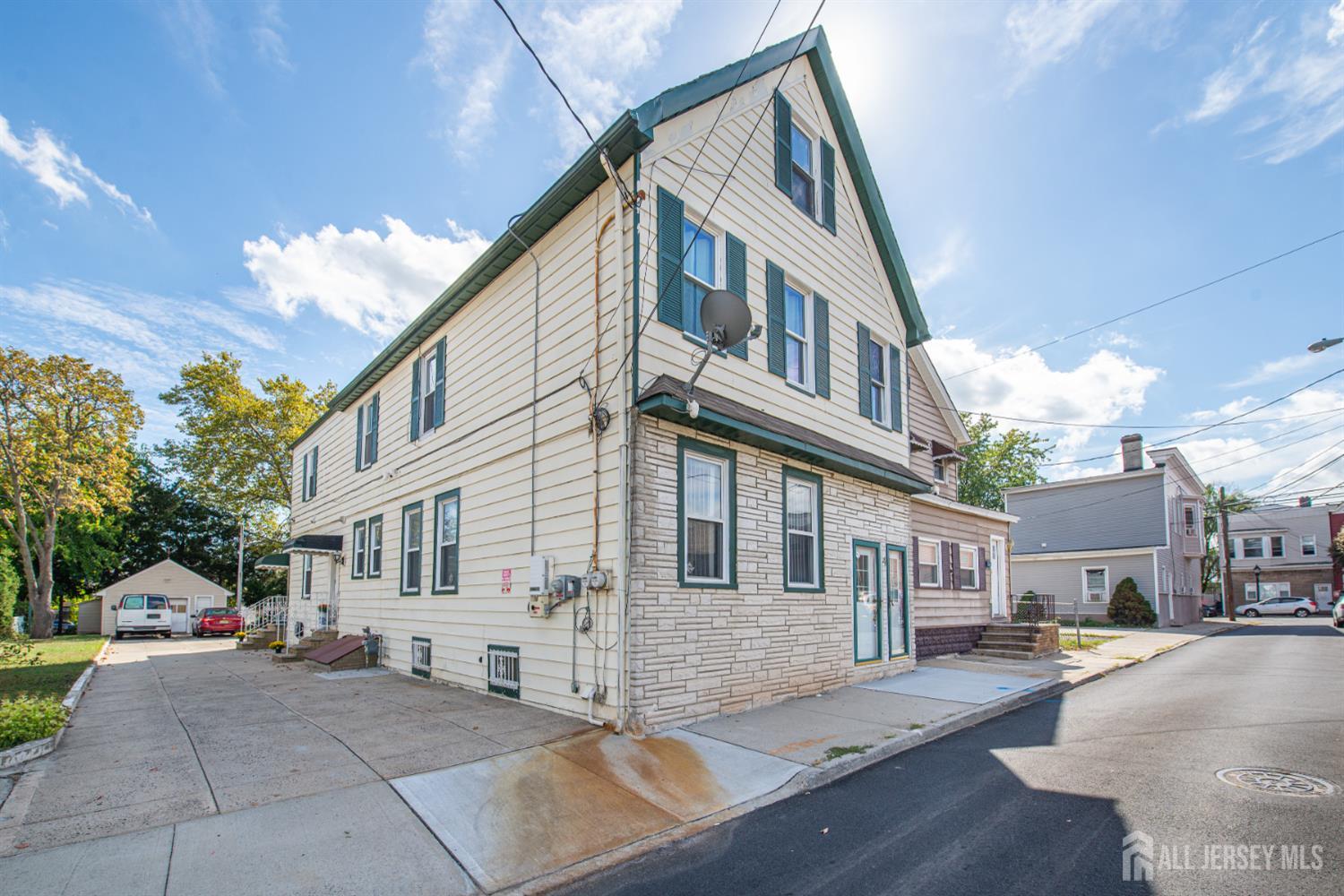 4 Lefferts Street Carteret, NJ 07008 - Photo 2 of 32 a front view of a house with a yard and outdoor seating