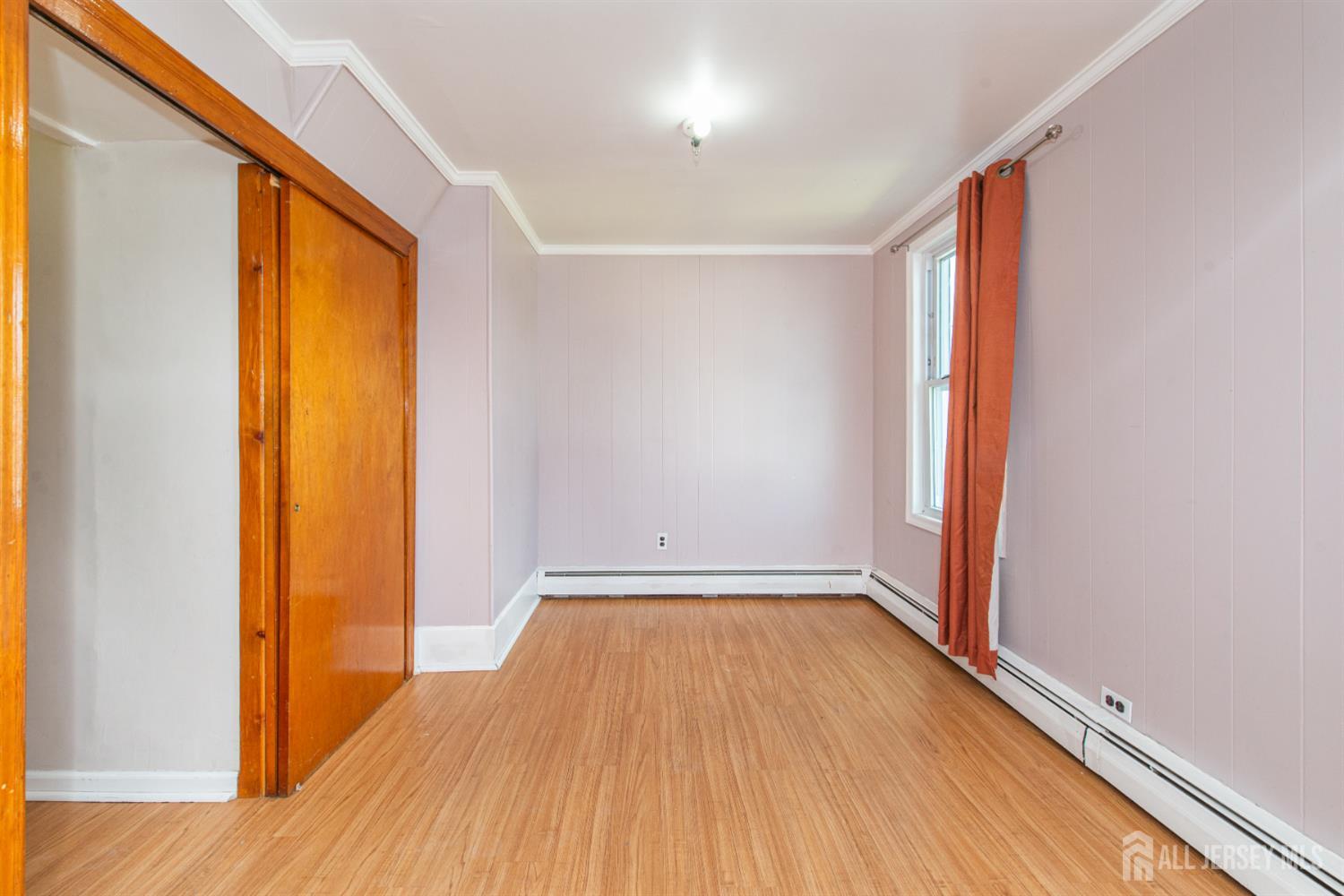 4 Lefferts Street Carteret, NJ 07008 - Photo 21 of 32 a view of a room with wooden floor and a window