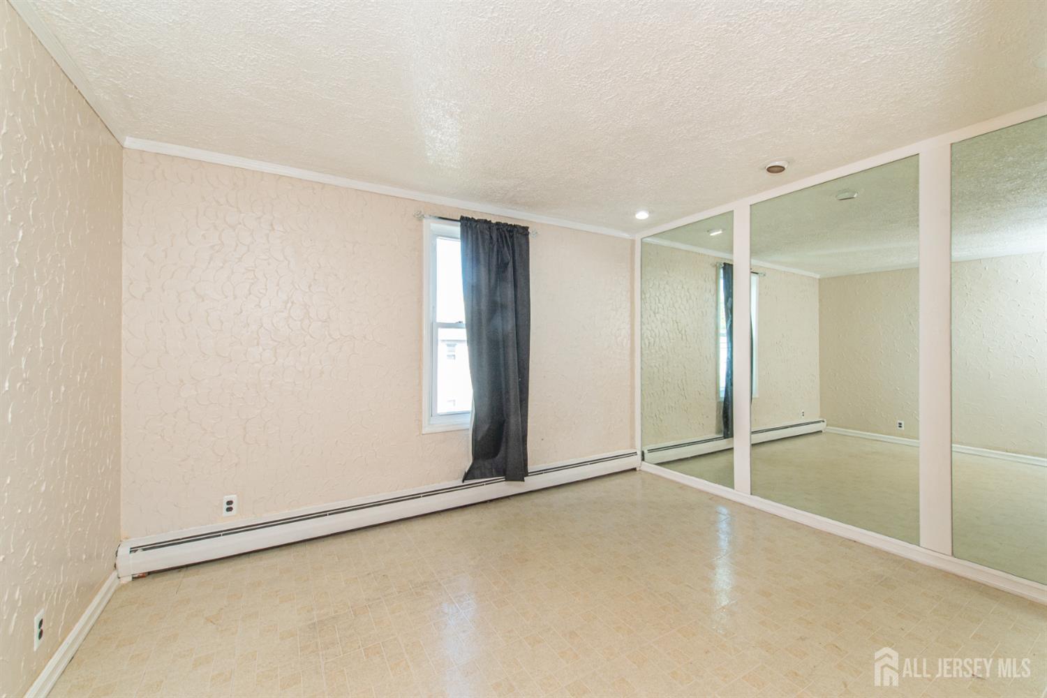 4 Lefferts Street Carteret, NJ 07008 - Photo 23 of 32 a view of an empty room