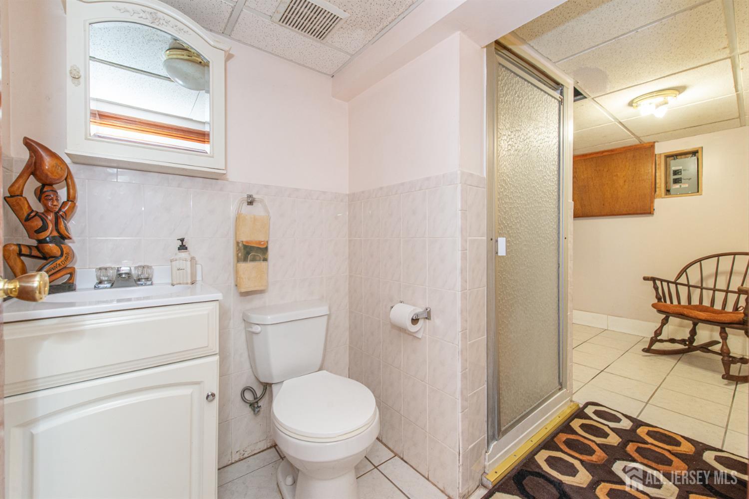 4 Lefferts Street Carteret, NJ 07008 - Photo 32 of 32 a bathroom with a sink toilet and shower