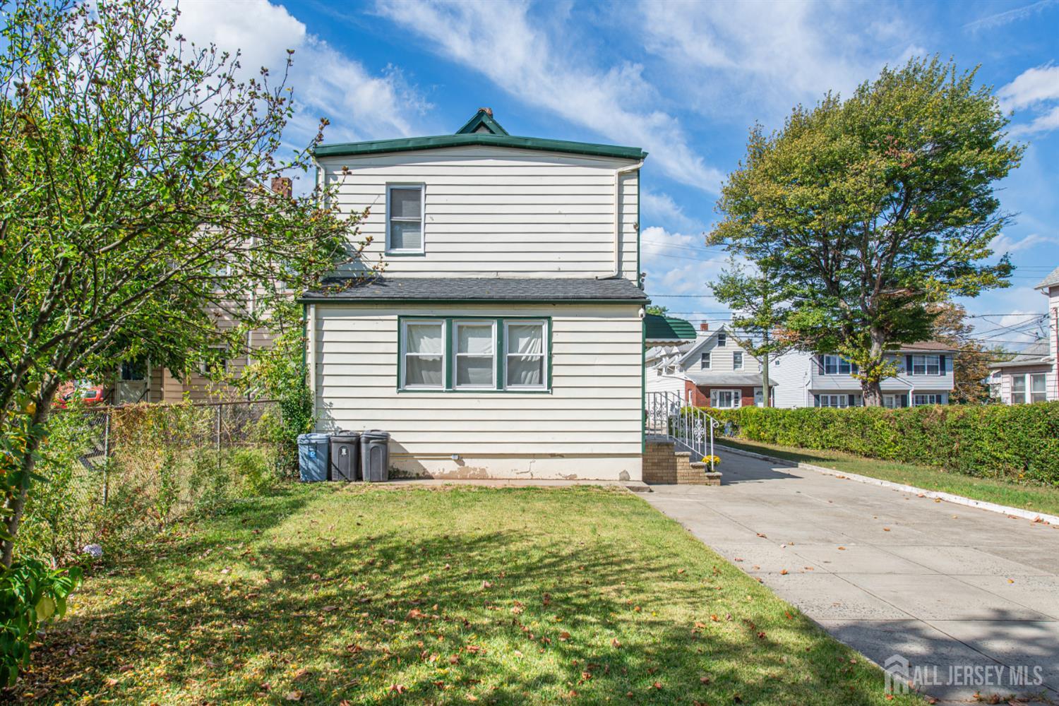 4 Lefferts Street Carteret, NJ 07008 - Photo 4 of 32 a view of a house with a yard