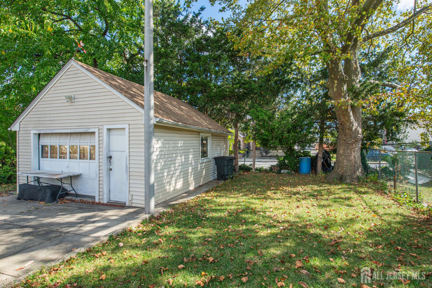 4 Lefferts Street Carteret, NJ 07008 - Photo 5 of 32 a view of a house with backyard and sitting area