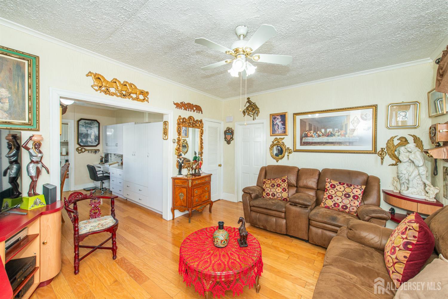 4 Lefferts Street Carteret, NJ 07008 - Photo 7 of 32 a living room with furniture and a chandelier