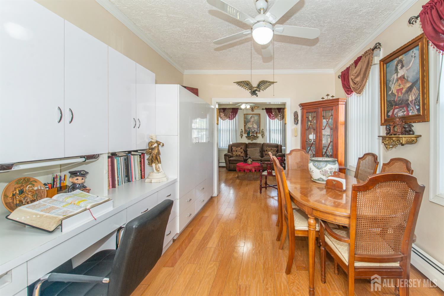 4 Lefferts Street Carteret, NJ 07008 - Photo 9 of 32 a workspace with furniture and chandelier