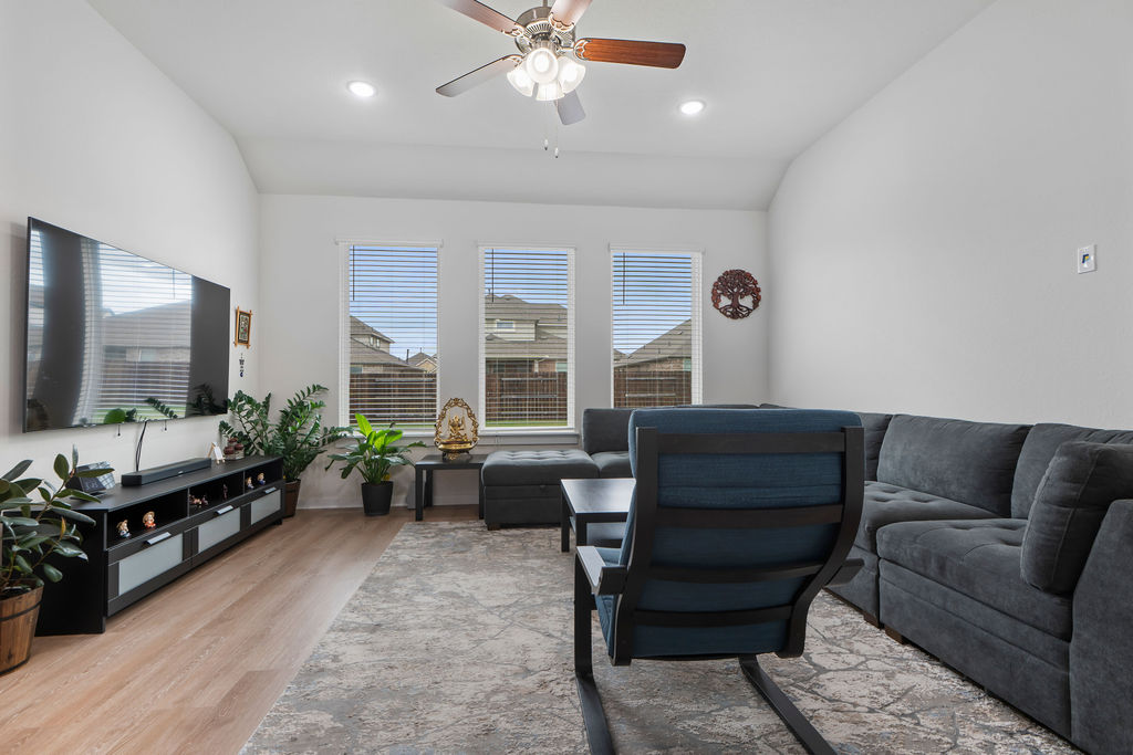 1813 Crow Hop View Leander, TX 78641 - Photo 10 of 33 a living room with furniture and wooden floor