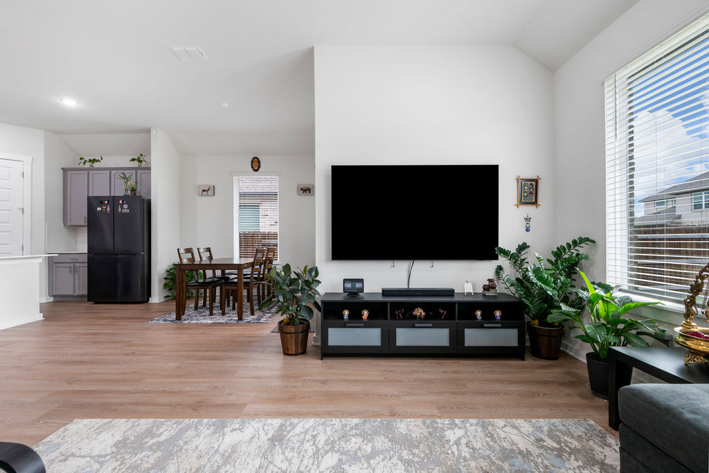 1813 Crow Hop View Leander, TX 78641 - Photo 11 of 33 a living room with furniture and a flat screen tv