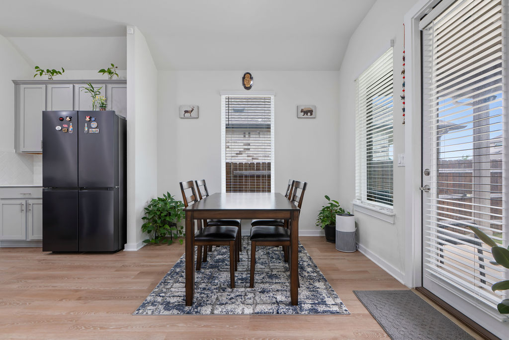 1813 Crow Hop View Leander, TX 78641 - Photo 15 of 33 a view of a dining room with furniture window and wooden floor