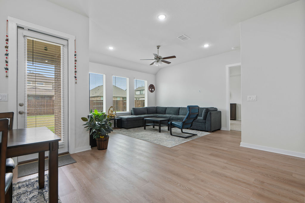 1813 Crow Hop View Leander, TX 78641 - Photo 18 of 33 a living room with furniture and wooden floor