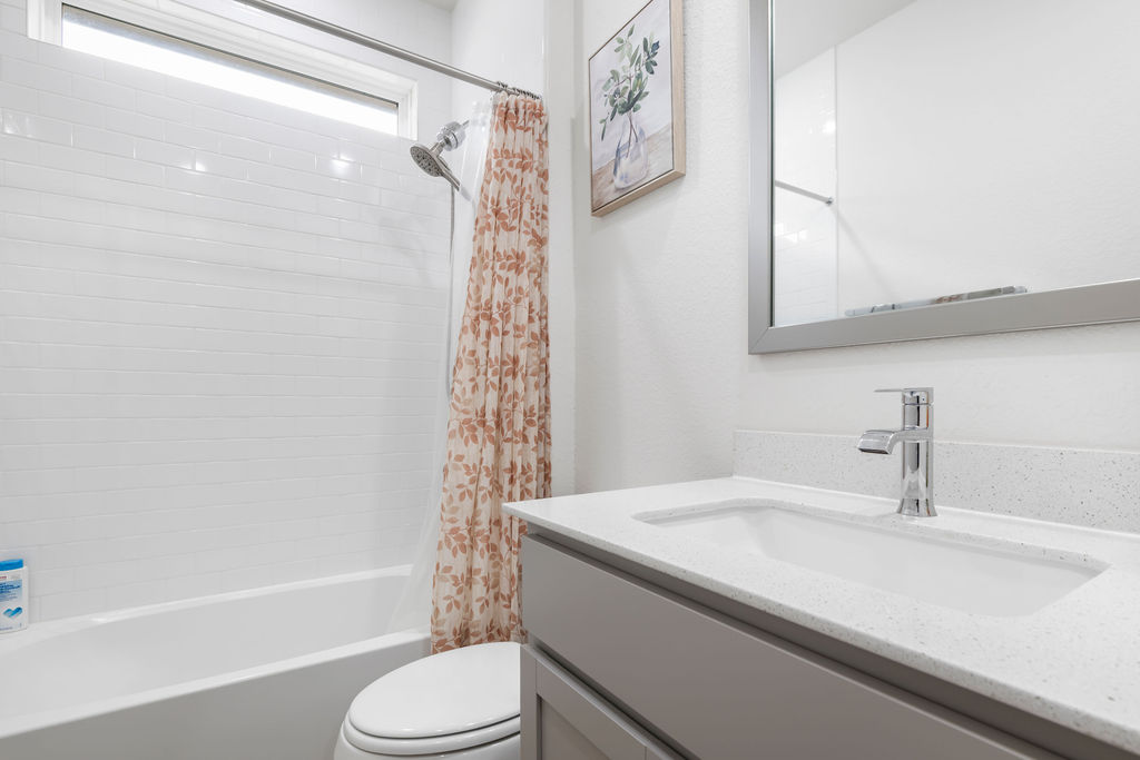 1813 Crow Hop View Leander, TX 78641 - Photo 22 of 33 a bathroom with a sink a toilet and a bathtub