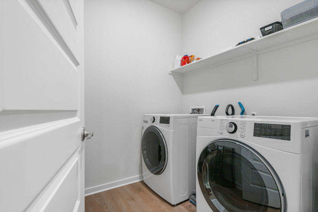 1813 Crow Hop View Leander, TX 78641 - Photo 25 of 33 a utility room with dryer and washer