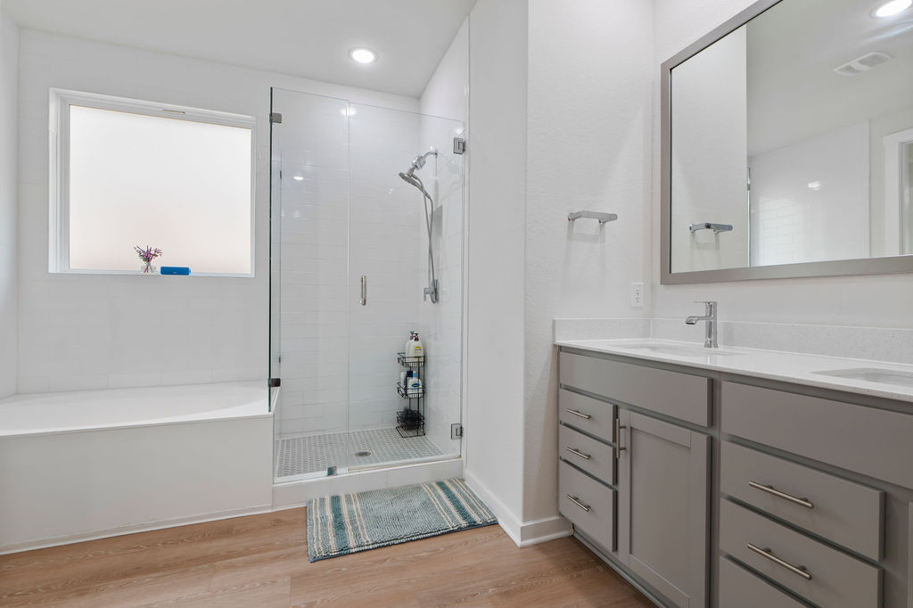 1813 Crow Hop View Leander, TX 78641 - Photo 26 of 33 a spacious bathroom with a tub sink and mirror