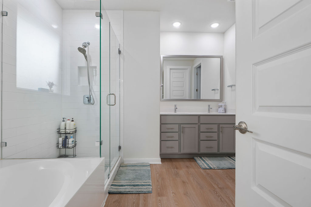 1813 Crow Hop View Leander, TX 78641 - Photo 27 of 33 a bathroom with a tub sink and mirror