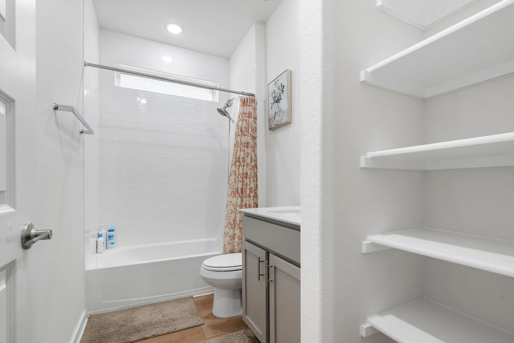 1813 Crow Hop View Leander, TX 78641 - Photo 29 of 33 a bathroom with a toilet and a bathtub
