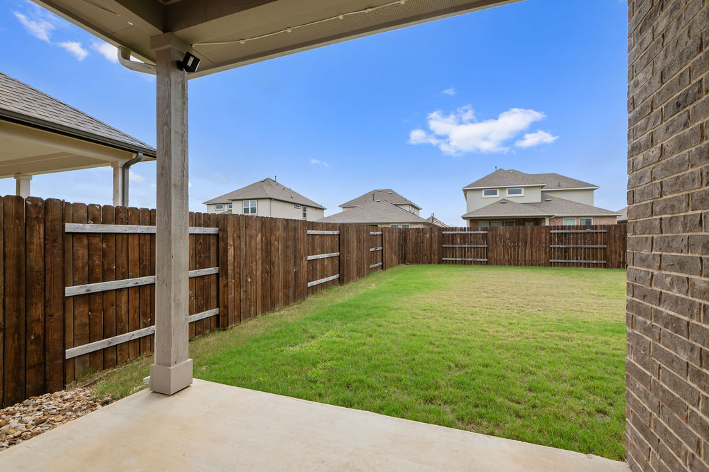 1813 Crow Hop View Leander, TX 78641 - Photo 30 of 33 a front view of a house with a yard
