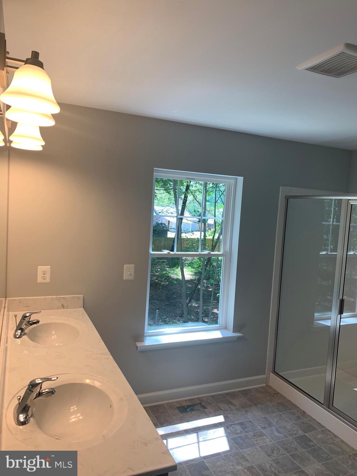128 Worcester Road Stevensville, MD 21666 - Photo 8 of 16 Master bathroom- Double vanity and spacious shower