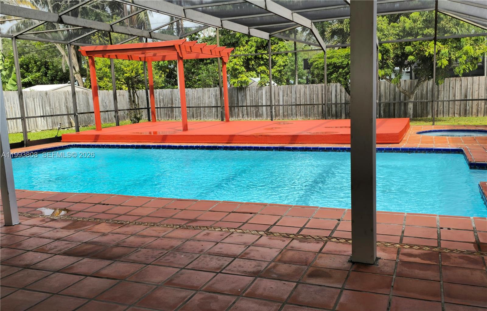 a view of swimming pool with a patio