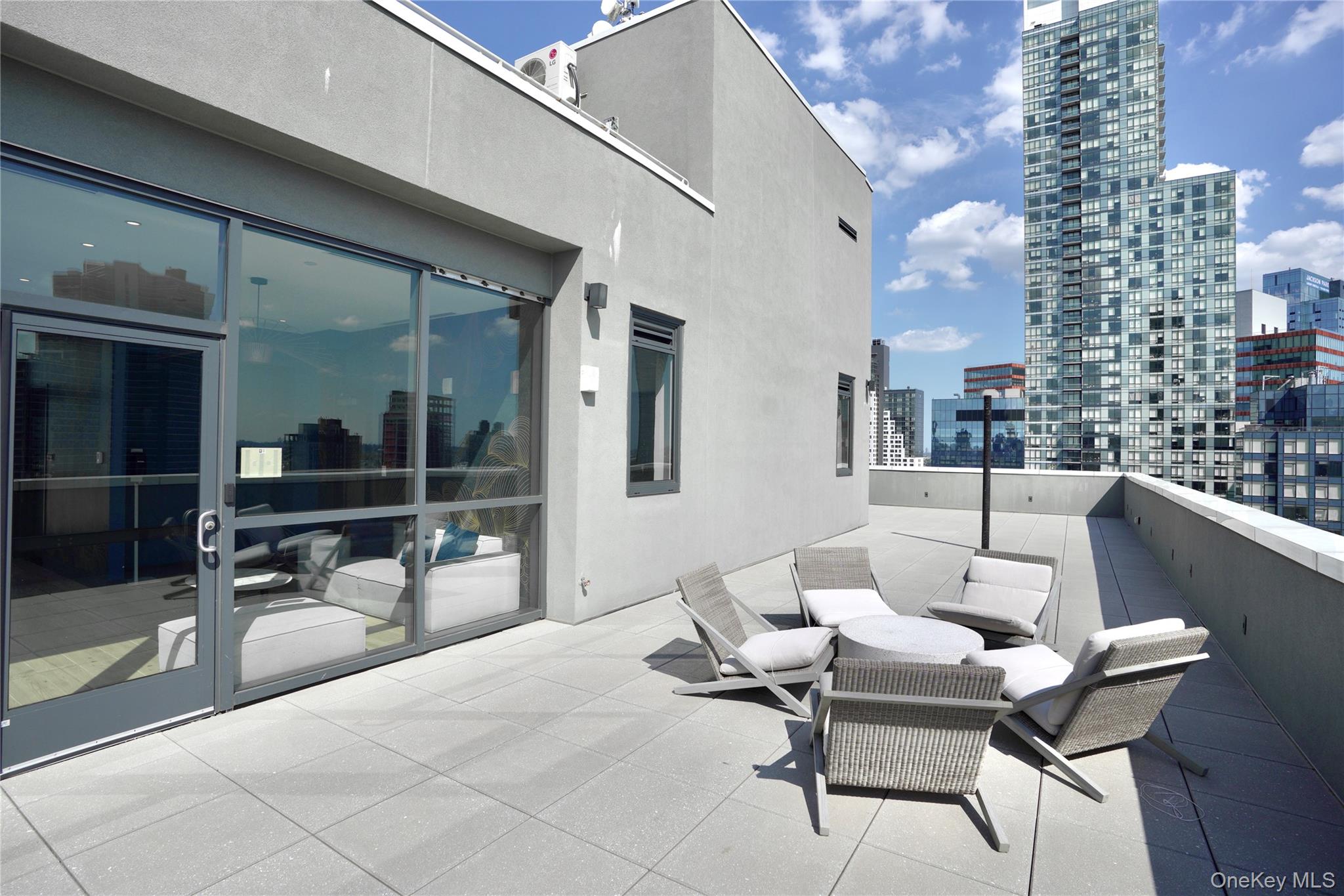 24-16 Queens Plaza South, Unit 2D Queens, NY 11101 - Photo 13 of 28 a building outdoor space with patio furniture and a potted plant