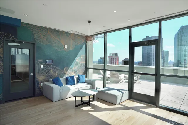 a living room with furniture and a large window