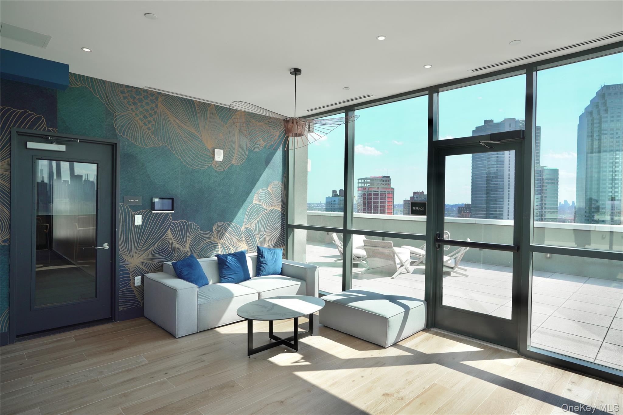 24-16 Queens Plaza South, Unit 2D Queens, NY 11101 - Photo 14 of 28 a living room with furniture and a large window