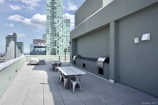a reading room with furniture and a rug
