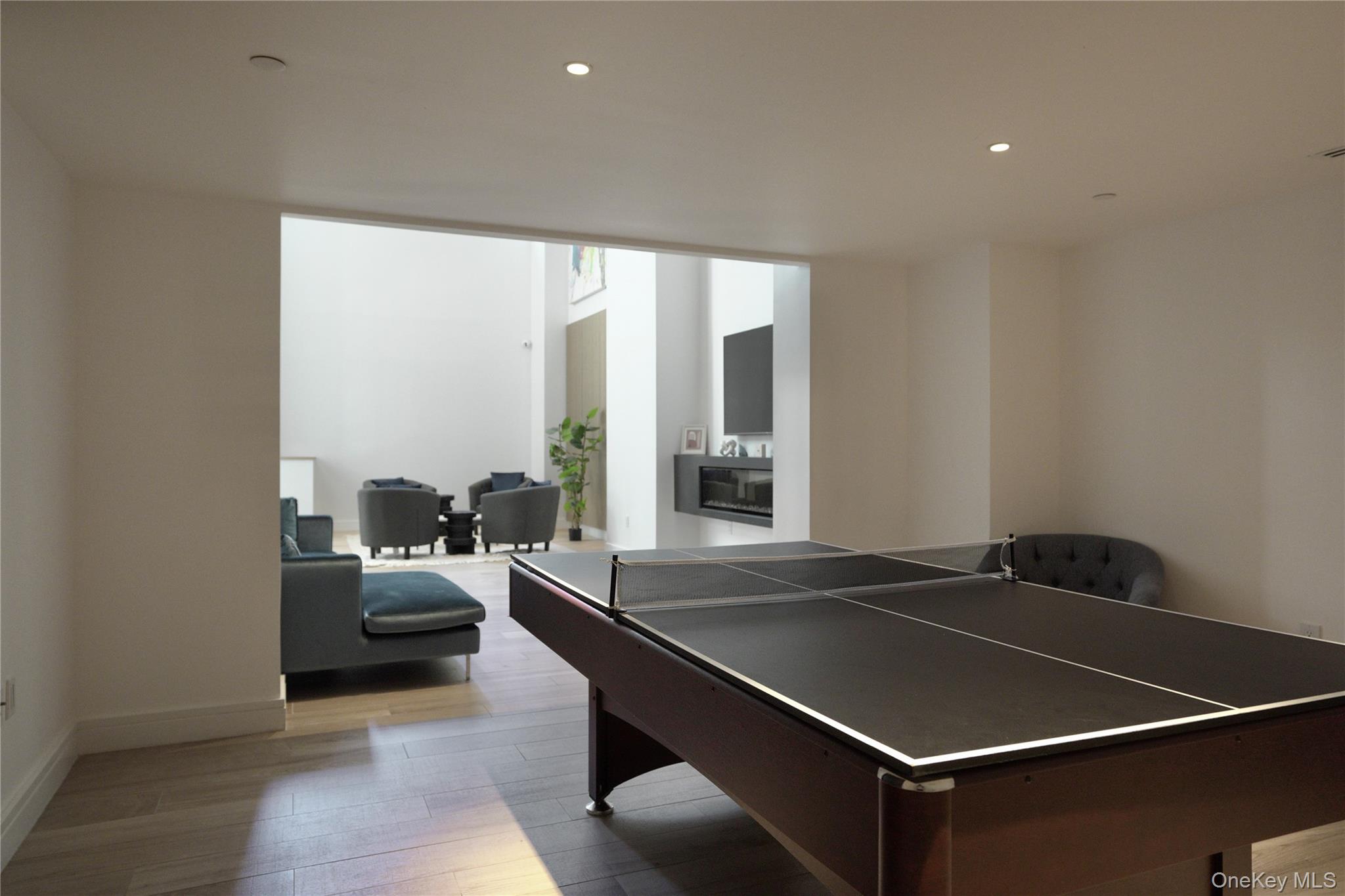 24-16 Queens Plaza South, Unit 2D Queens, NY 11101 - Photo 23 of 28 a living room with a table