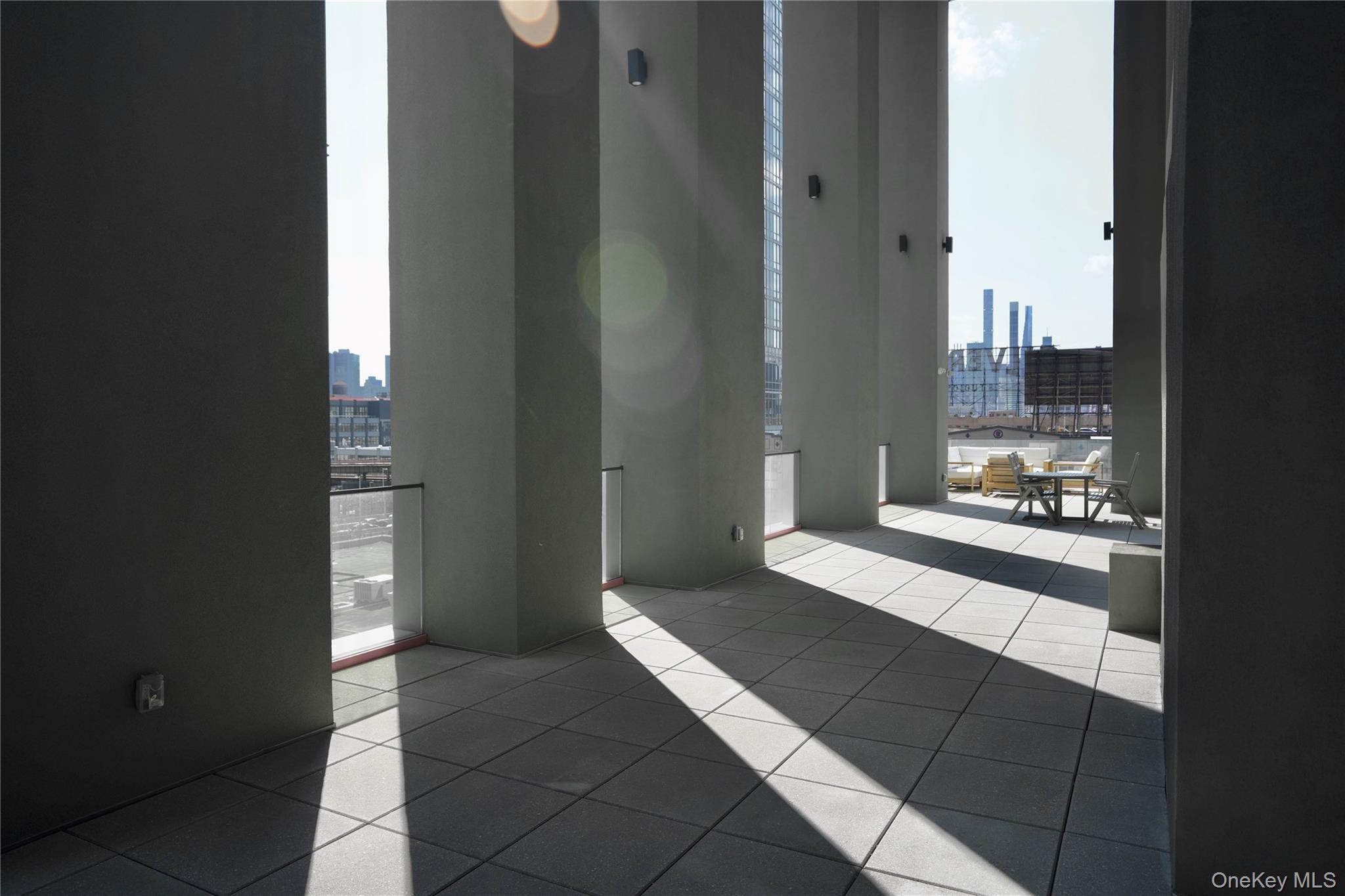 24-16 Queens Plaza South, Unit 2D Queens, NY 11101 - Photo 27 of 28 a view of a bathroom with a bathtub and shower