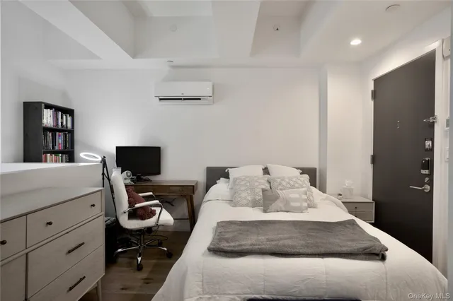 a bedroom with a bed and furniture