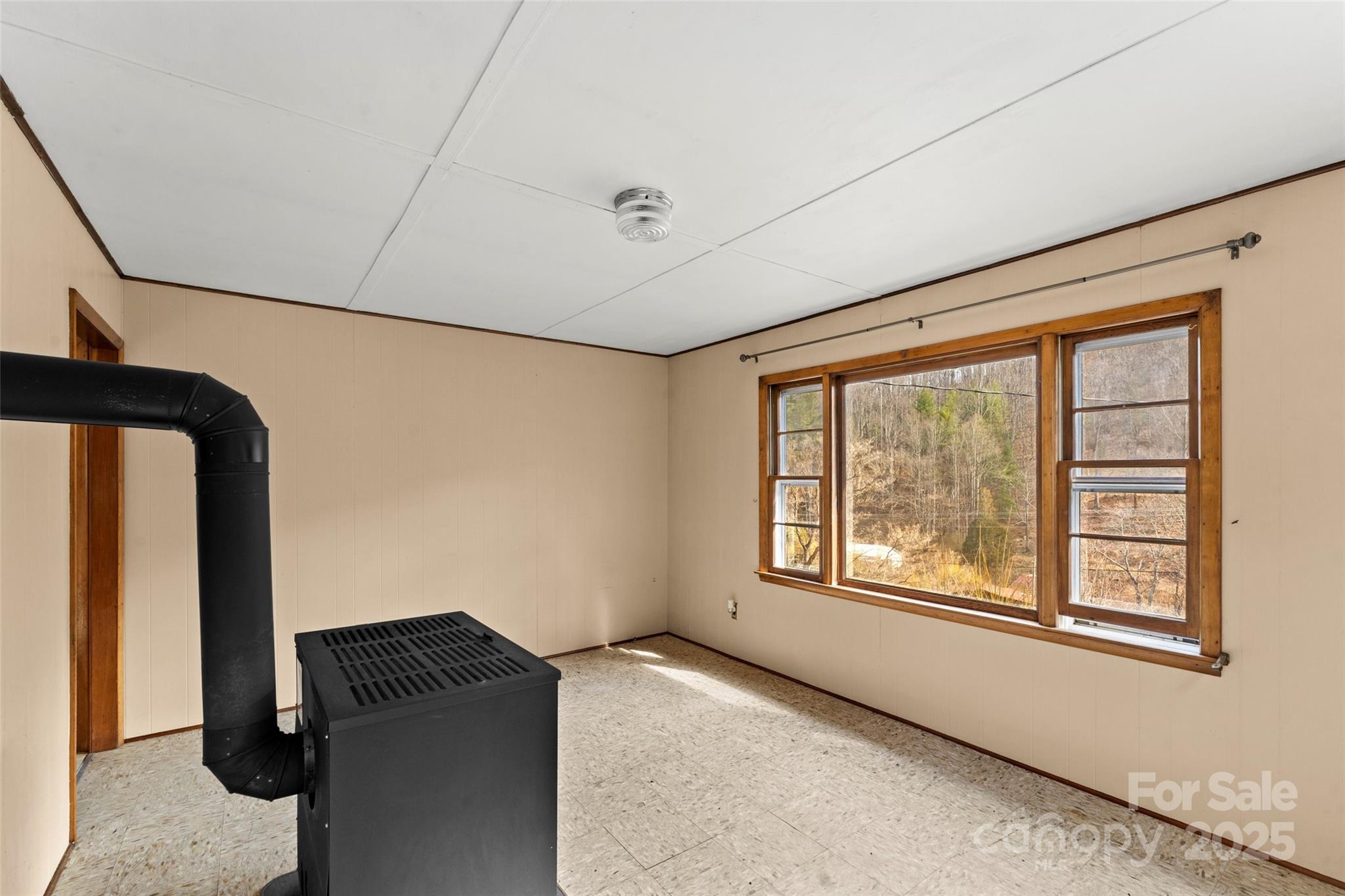 10999 Rush Fork Road Clyde, NC 28721 - Photo 12 of 38 a view of an empty room and window