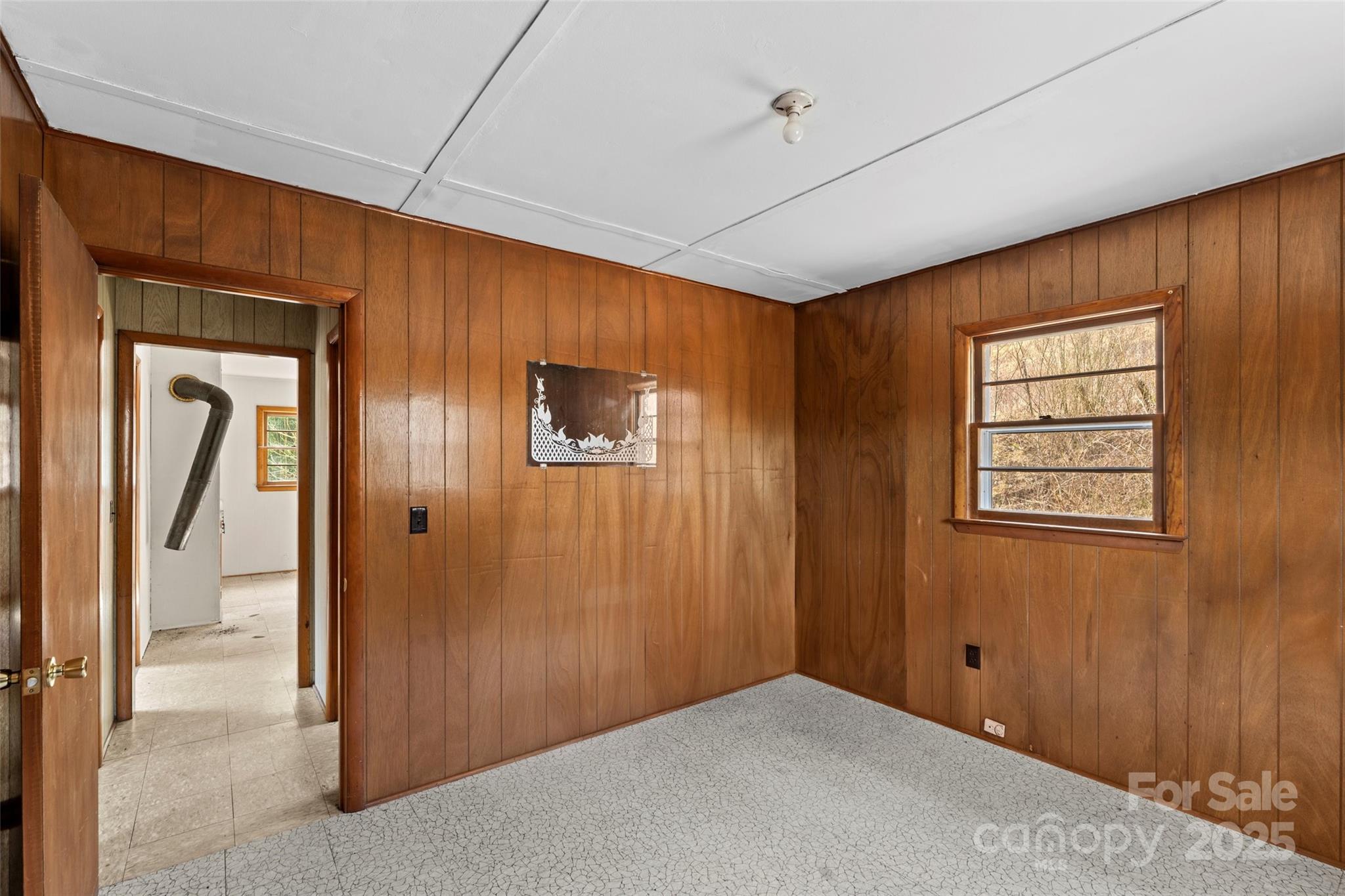 10999 Rush Fork Road Clyde, NC 28721 - Photo 18 of 38 an empty room with windows