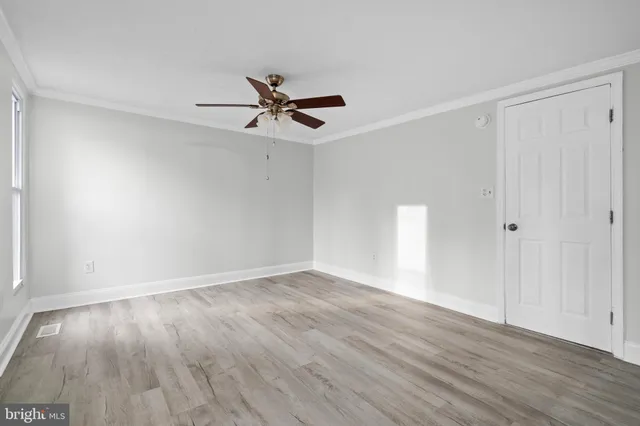 a bathroom with a toilet sink vanity and mirror