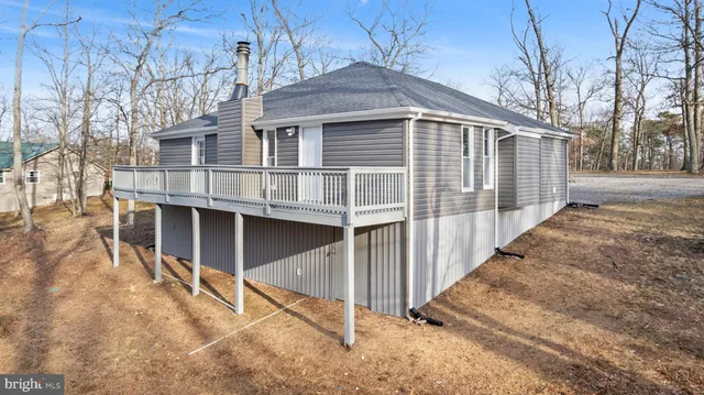 a house with trees in the background