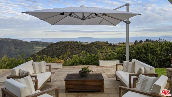 a view of balcony with furniture