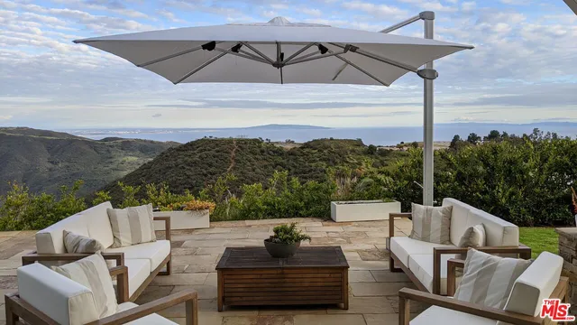 a view of balcony with furniture