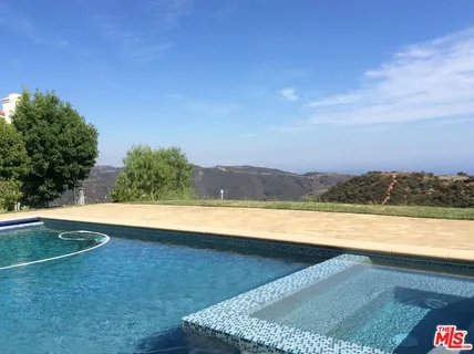 a view of a balcony with chairs