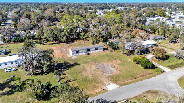 a view of a yard with a tree