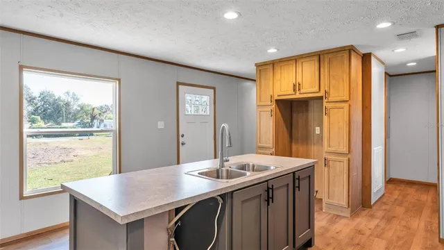a bathroom with a sink a vanity and a mirror