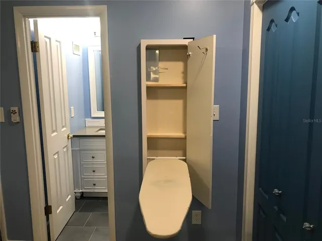 a bathroom with a sink a mirror and a window