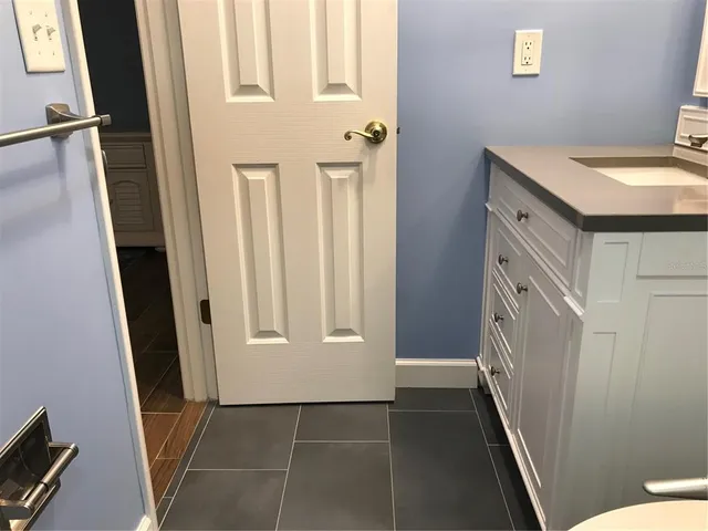 a bathroom with a toilet a sink and shower