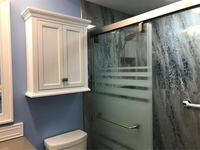 a bathroom with a toilet and a sink