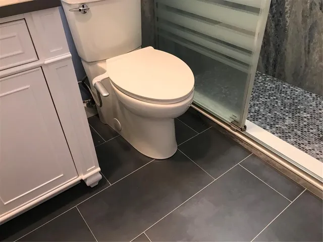 a kitchen with granite countertop a sink cabinets and stainless steel appliances