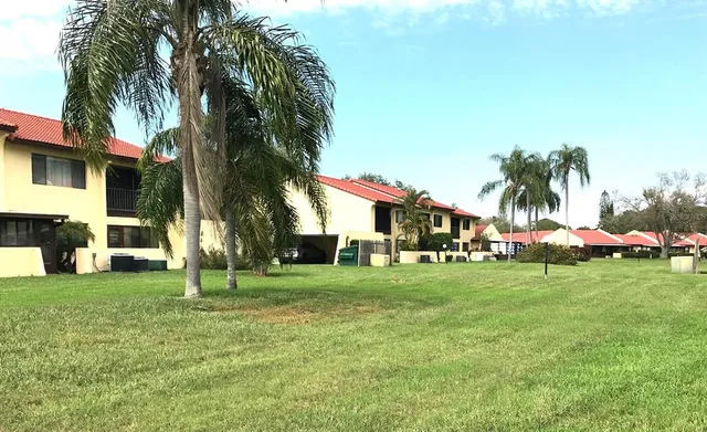 a view of a swimming pool and a yard