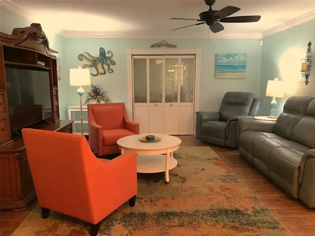 a living room with furniture and a window