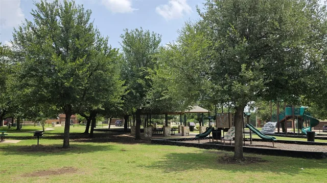 a building view with swimming pool and trees